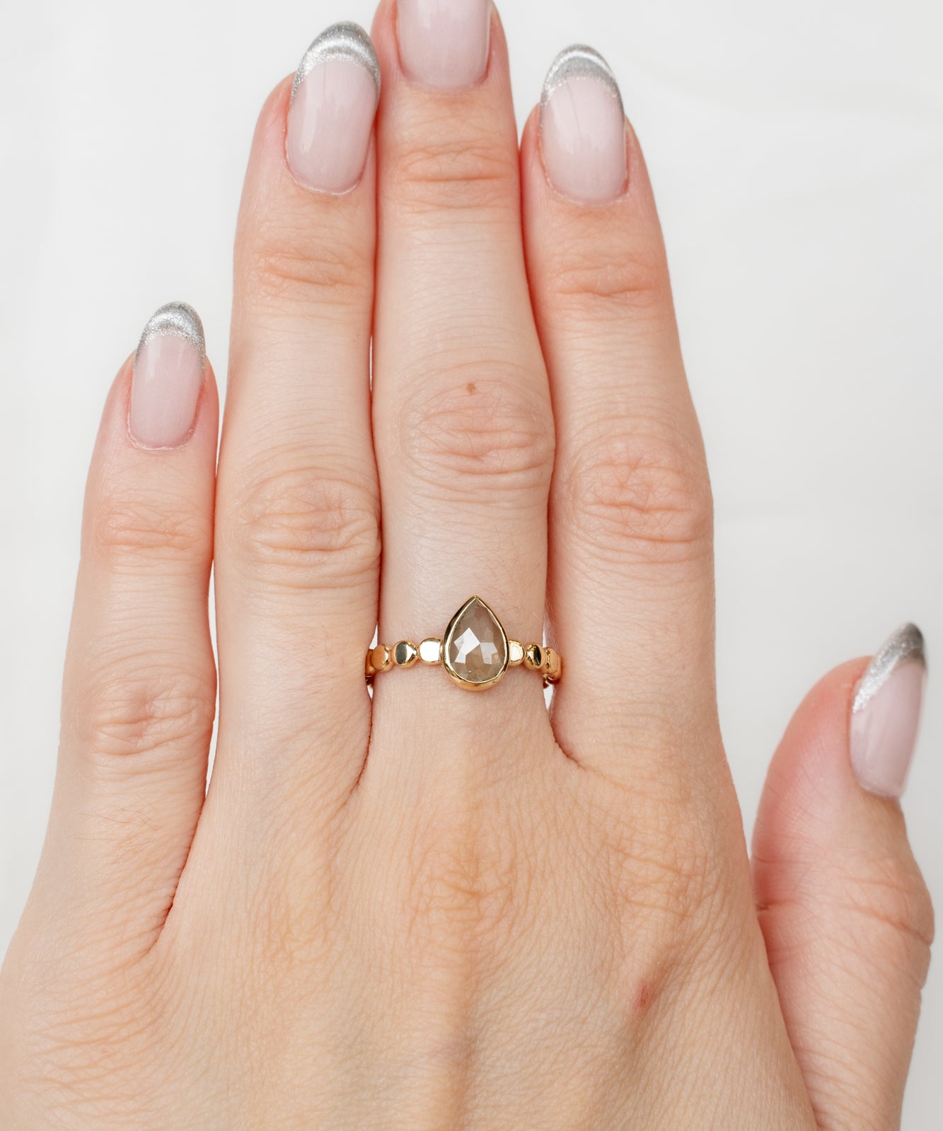 Model wearing Bellatrix Ring with diamond