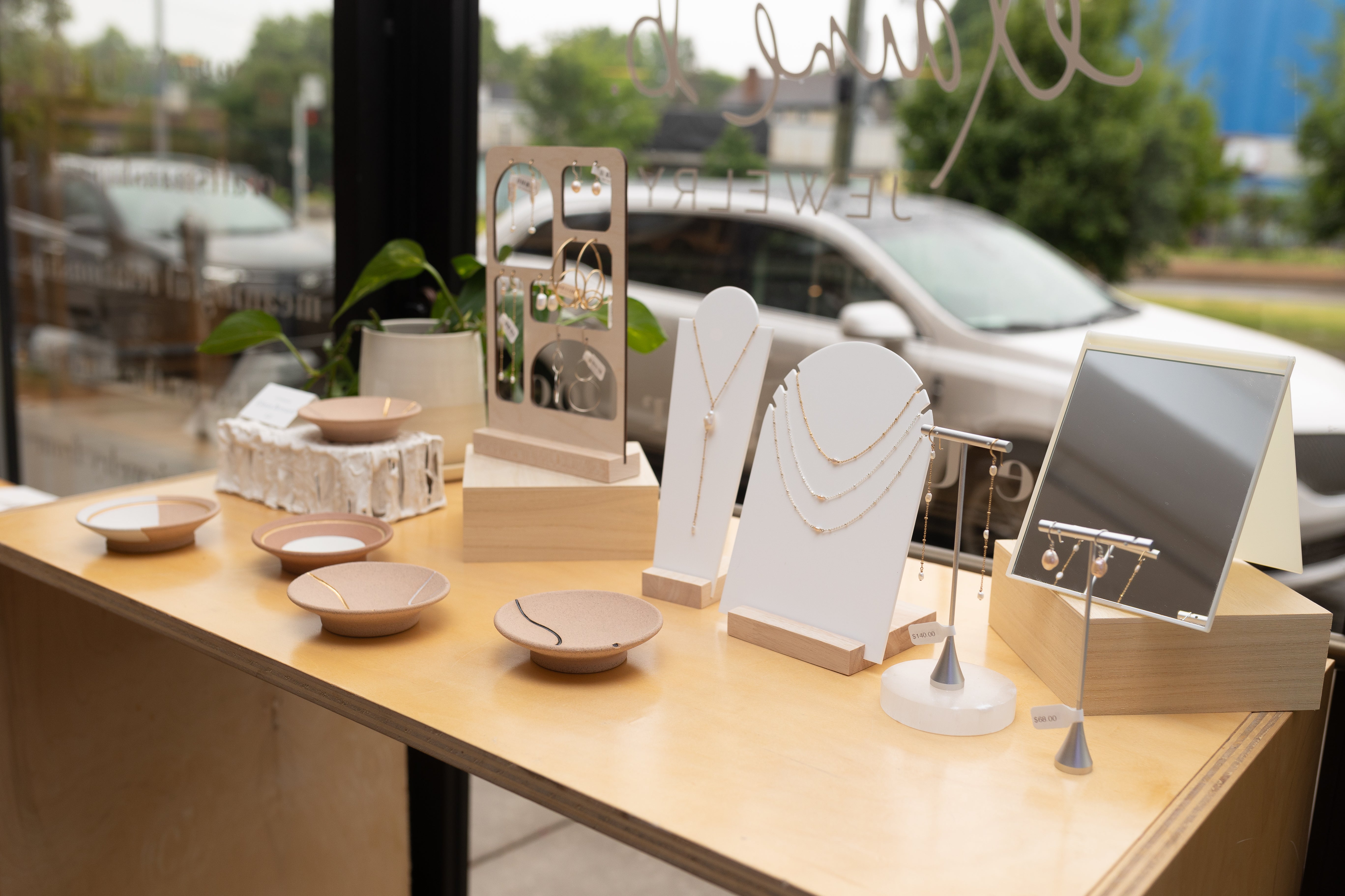 A variety of jewelry and accessories beautifully displayed on a table at Elaine B Jewelry Cincinnati Store.