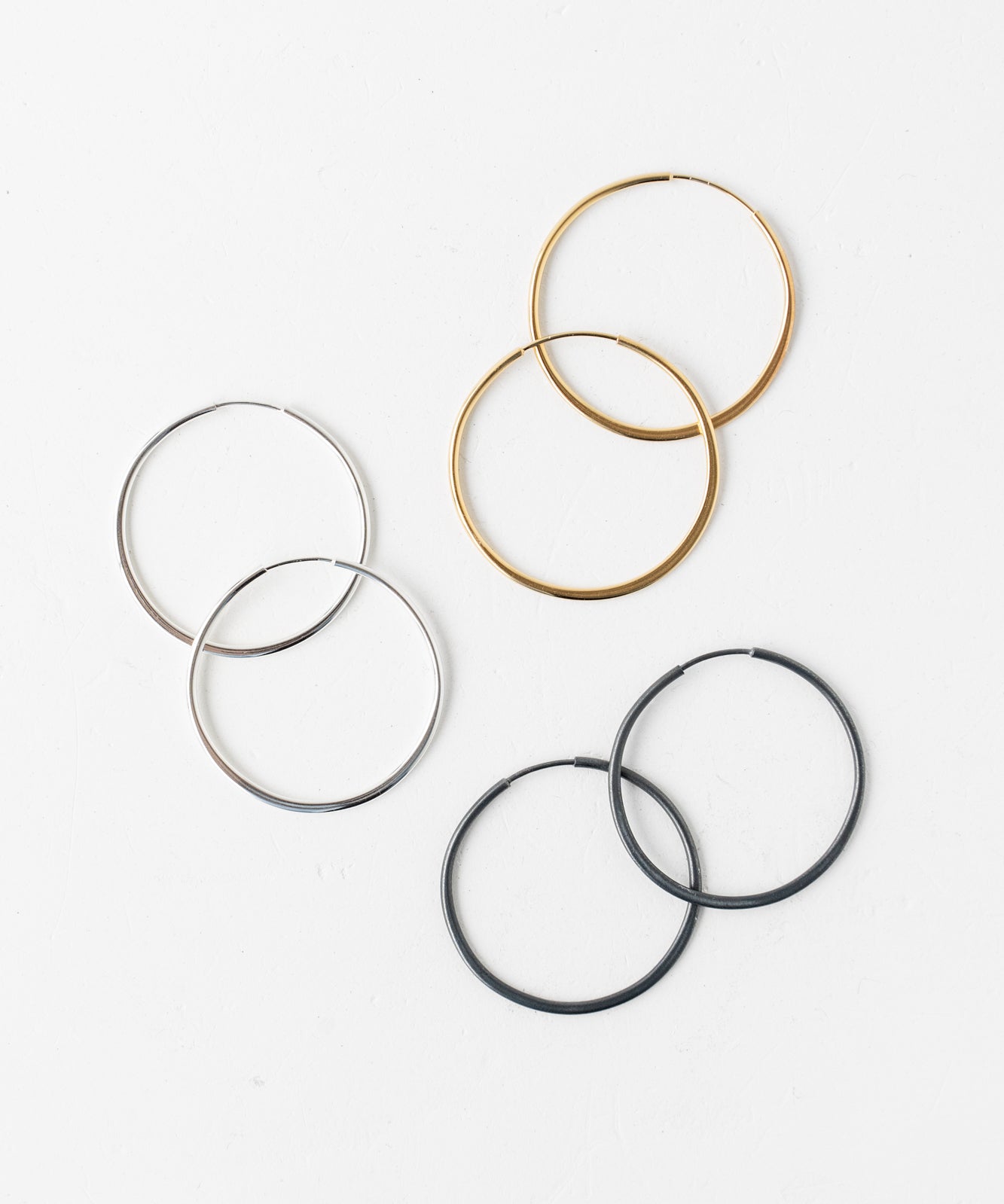 Collection of assorted concentric hoop earrings