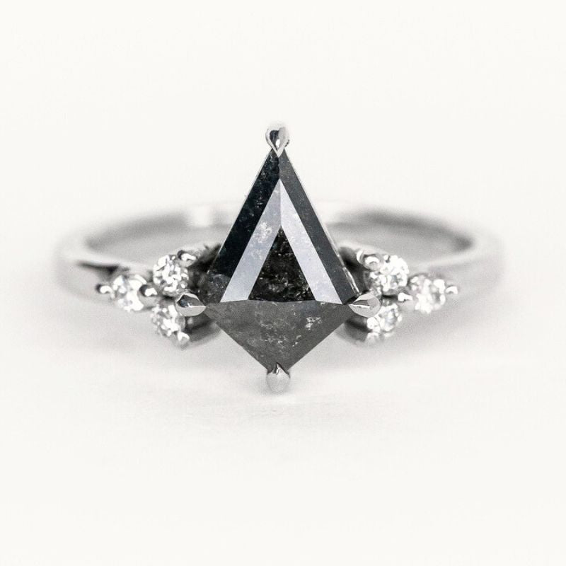 A stunning handmade black kite shaped diamond ring with sparkling side diamond, showcasing exquisite custom jewelry craftsmanship.