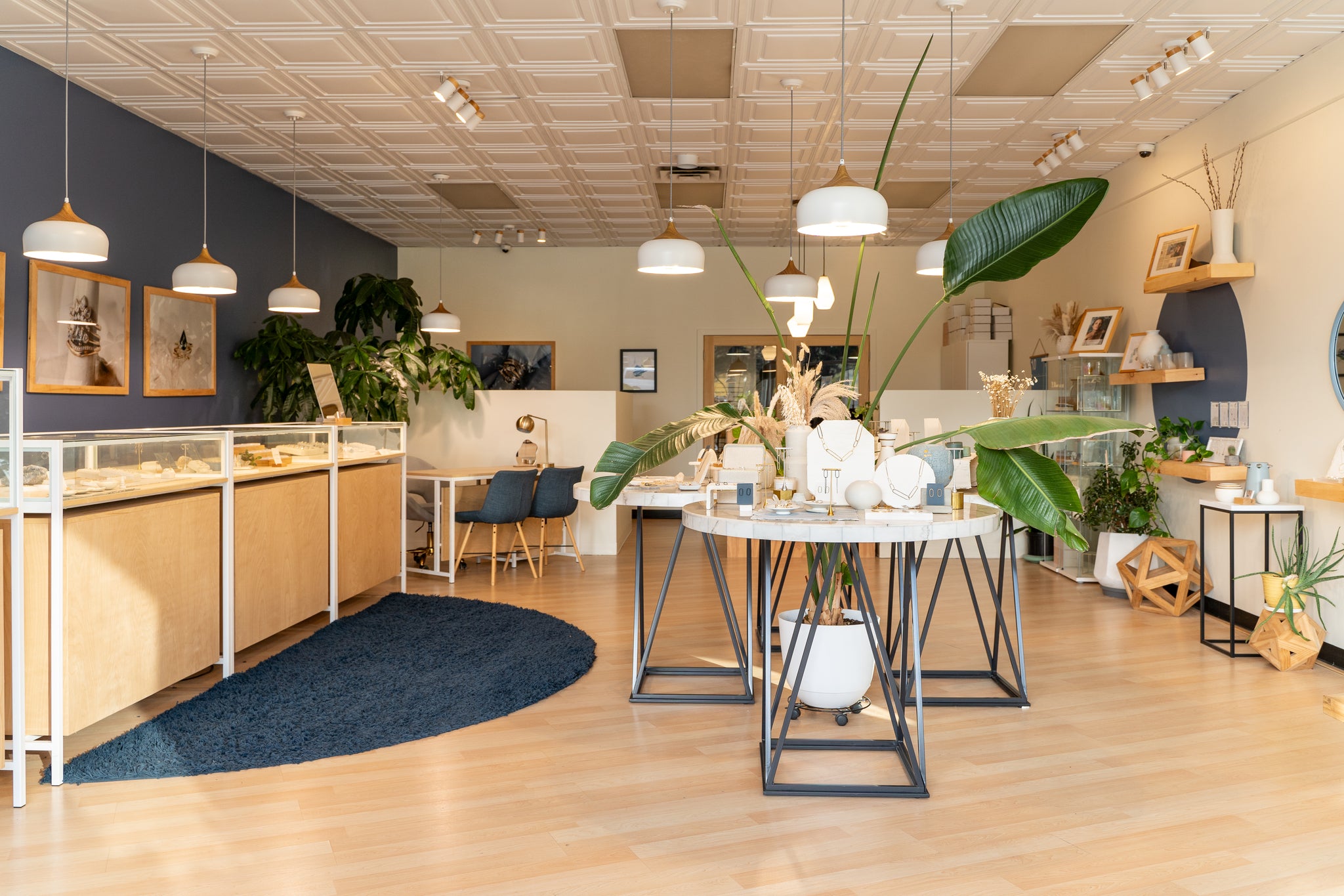 A jewelry store in Detroit named Elaine B Jewelry, filled with numerous plants and greenery.