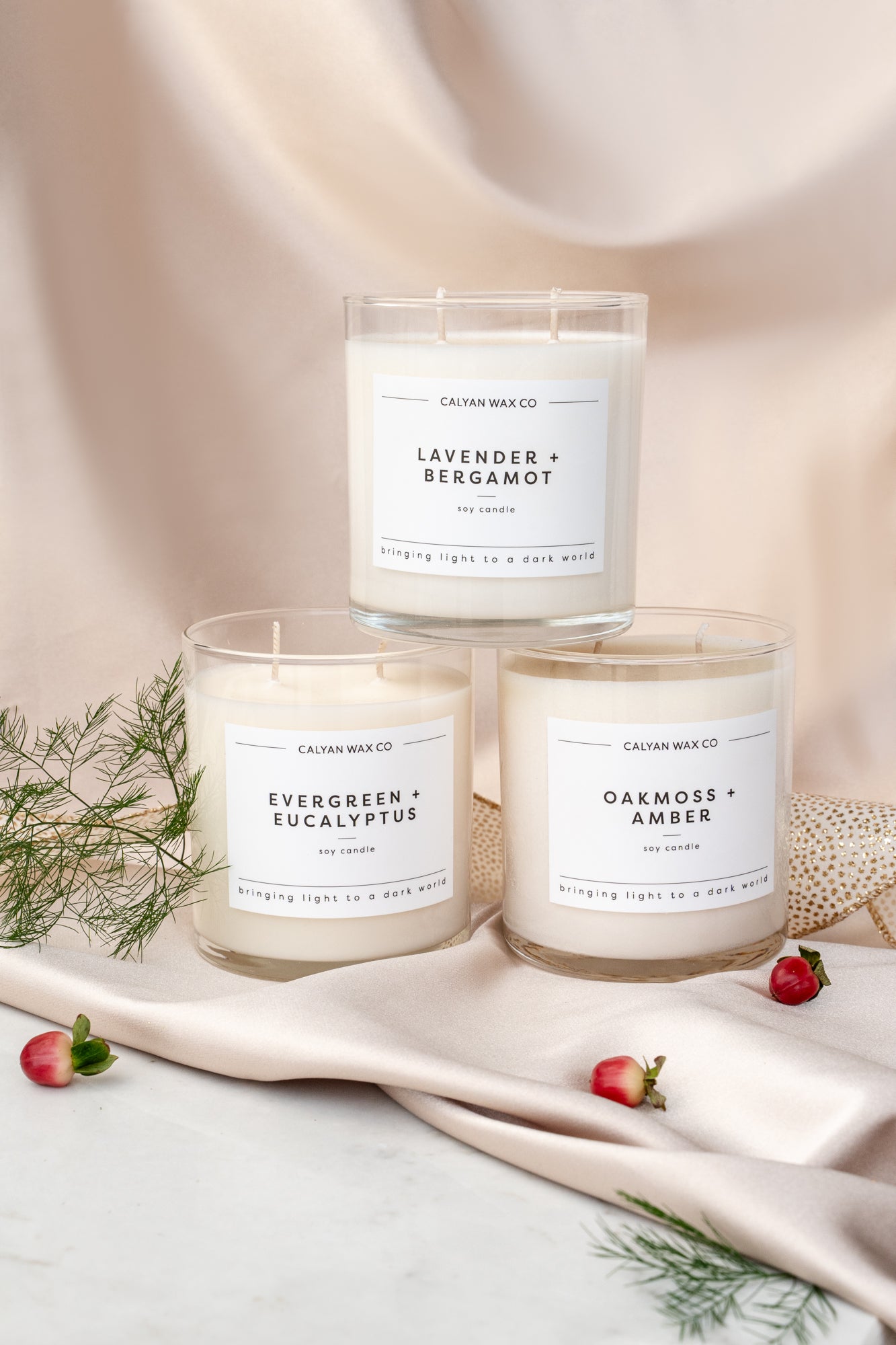 Candles, gifts, and accessories in a holiday scene.