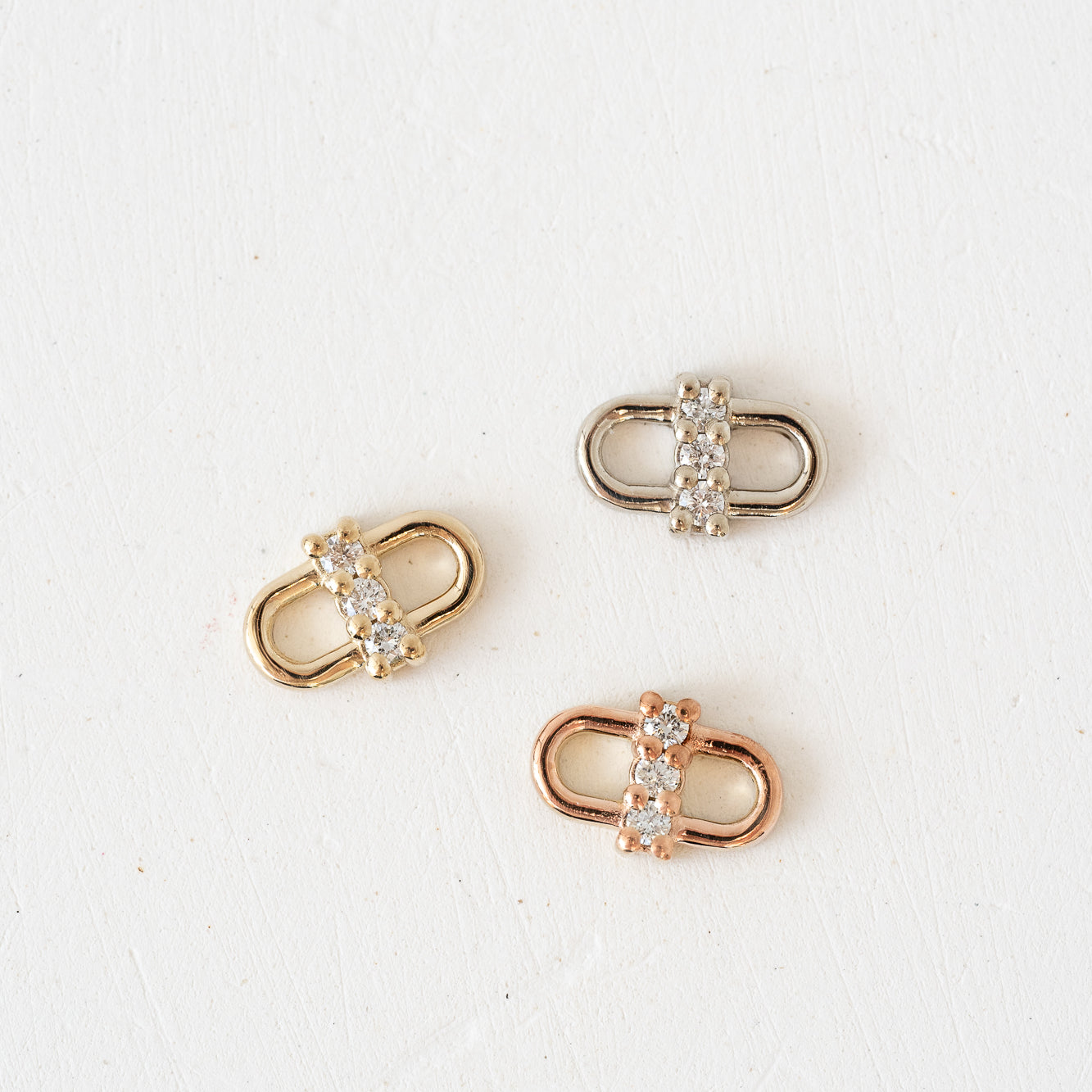Three rose, gold and white diamond charms with Forever Linked Locket Lab Diamond Charms.