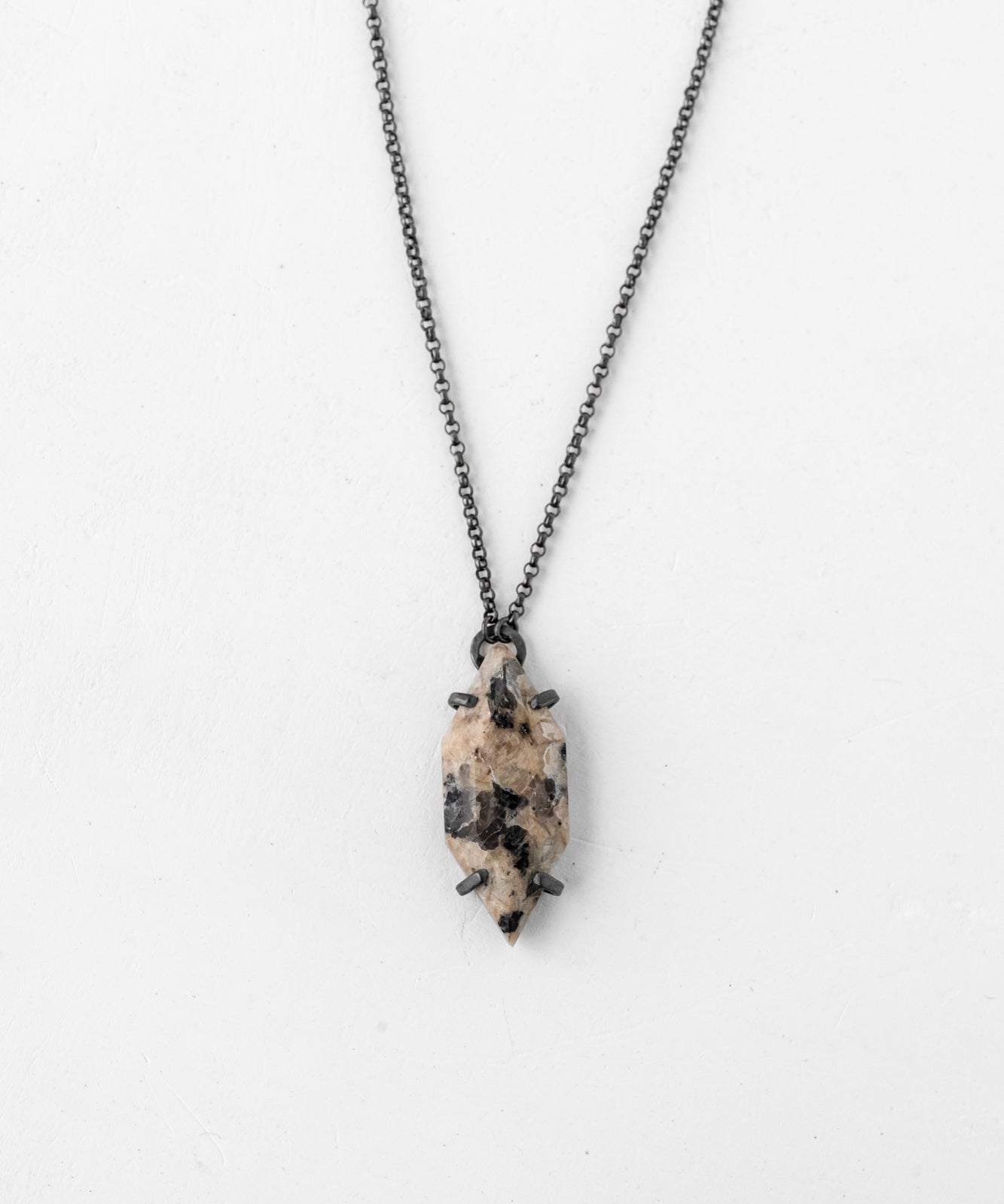 Vertical speckled oxidized necklace on neutral