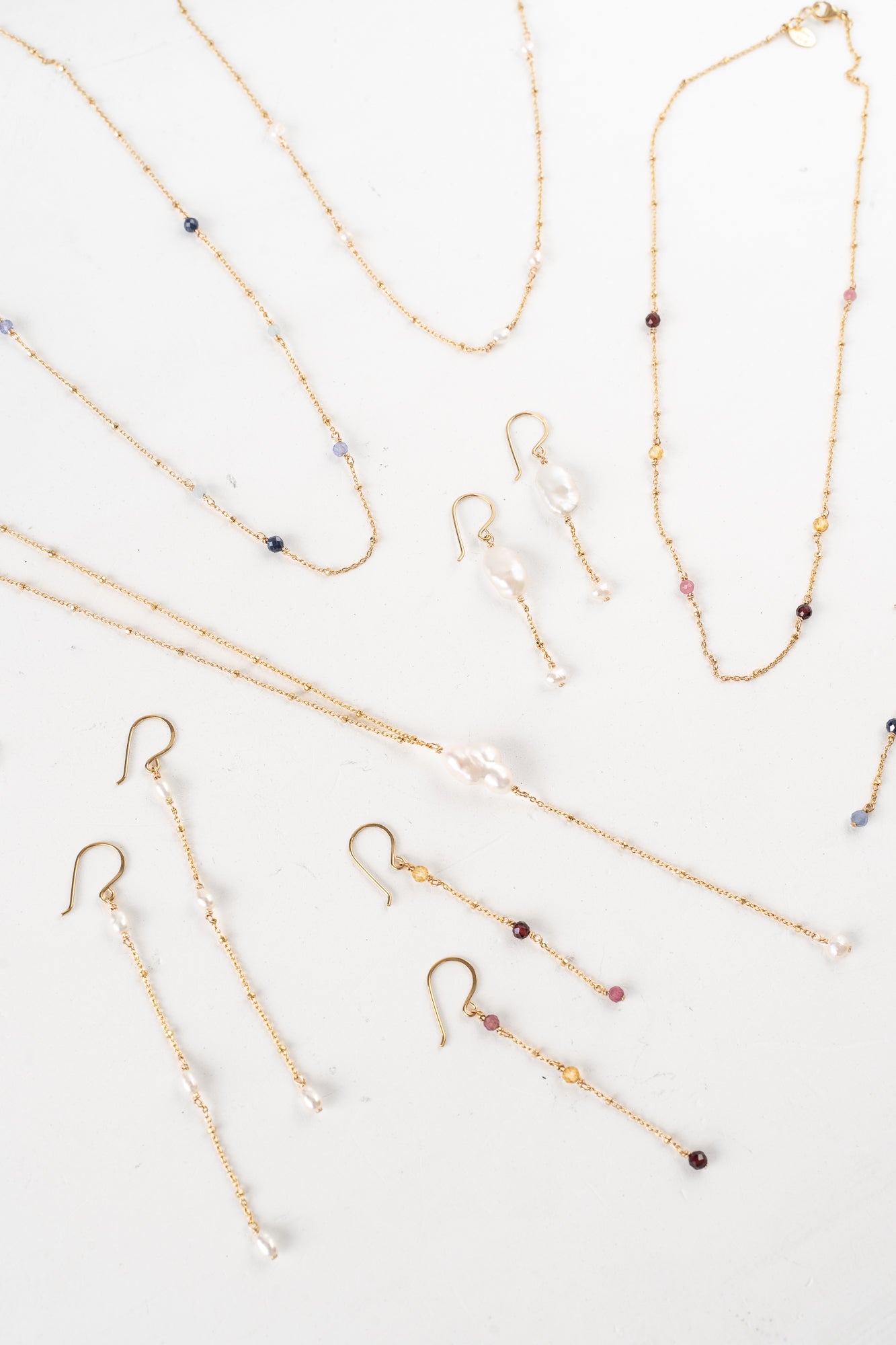 Gold and pearl necklaces and earrings from Cloud Collection - timeless, airy, and whimsical jewelry.