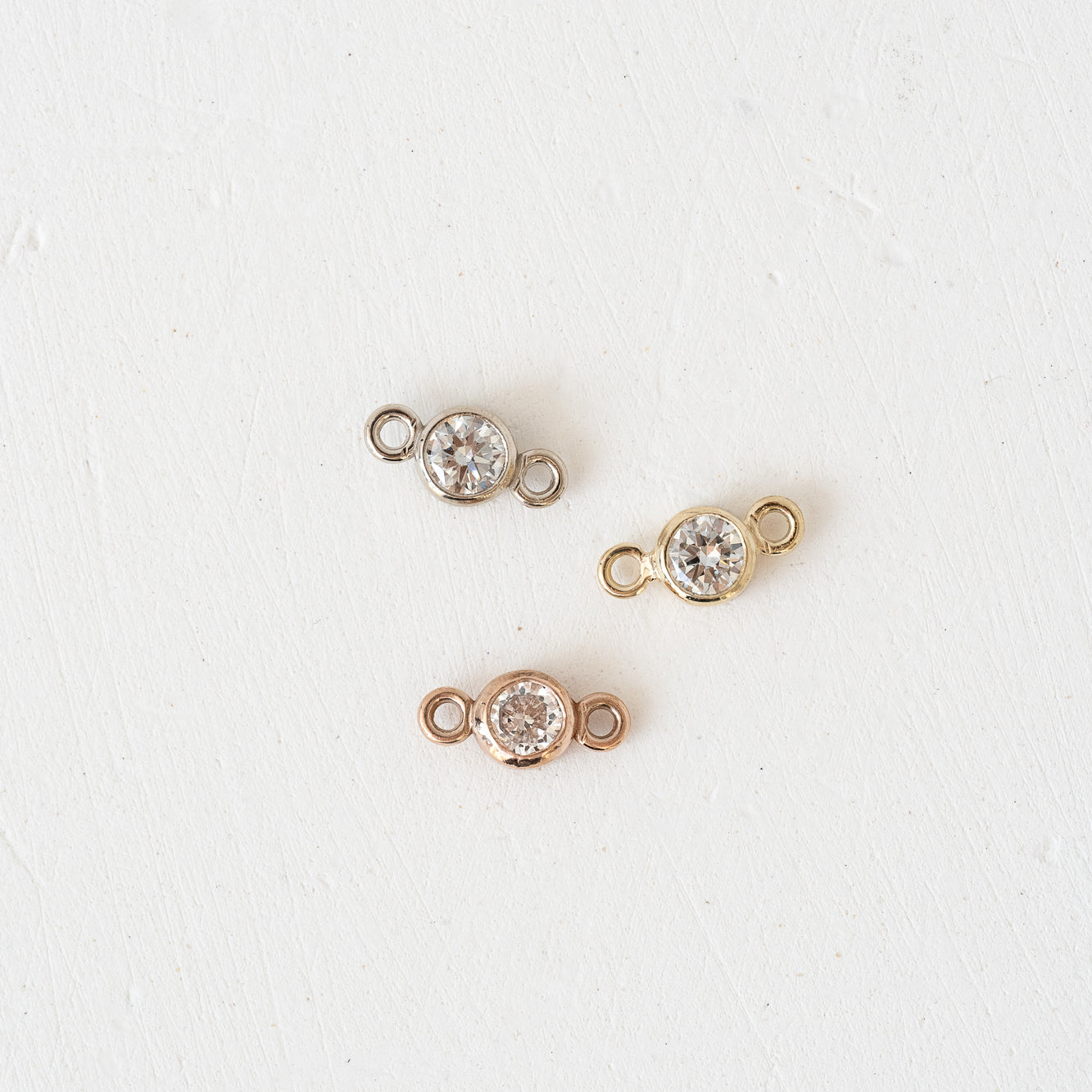 Three 3mm Forever Linked Bezel Lab Diamond earrings in rose, yellow, white gold