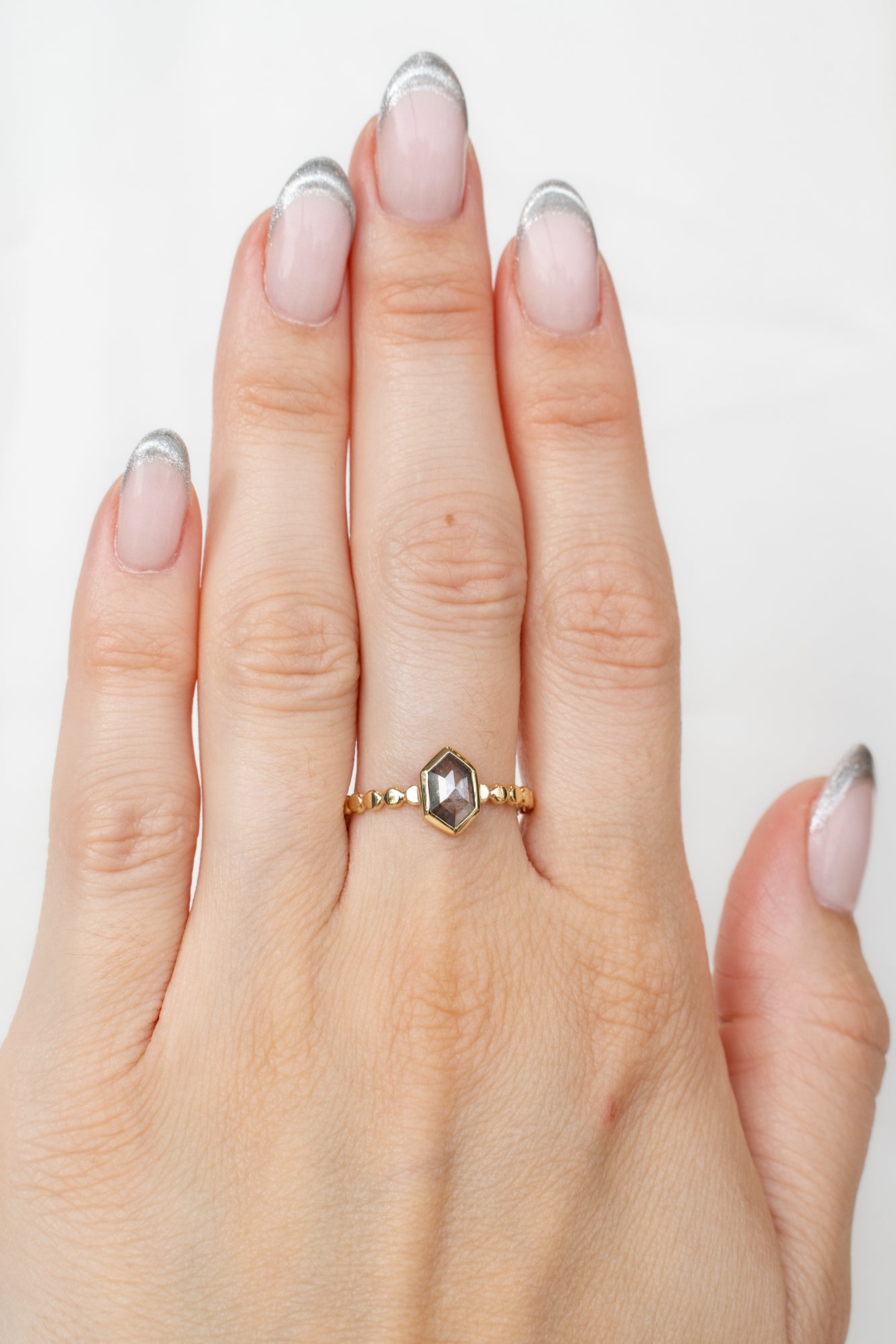 Model wearing Bellatrix Ring with diamond