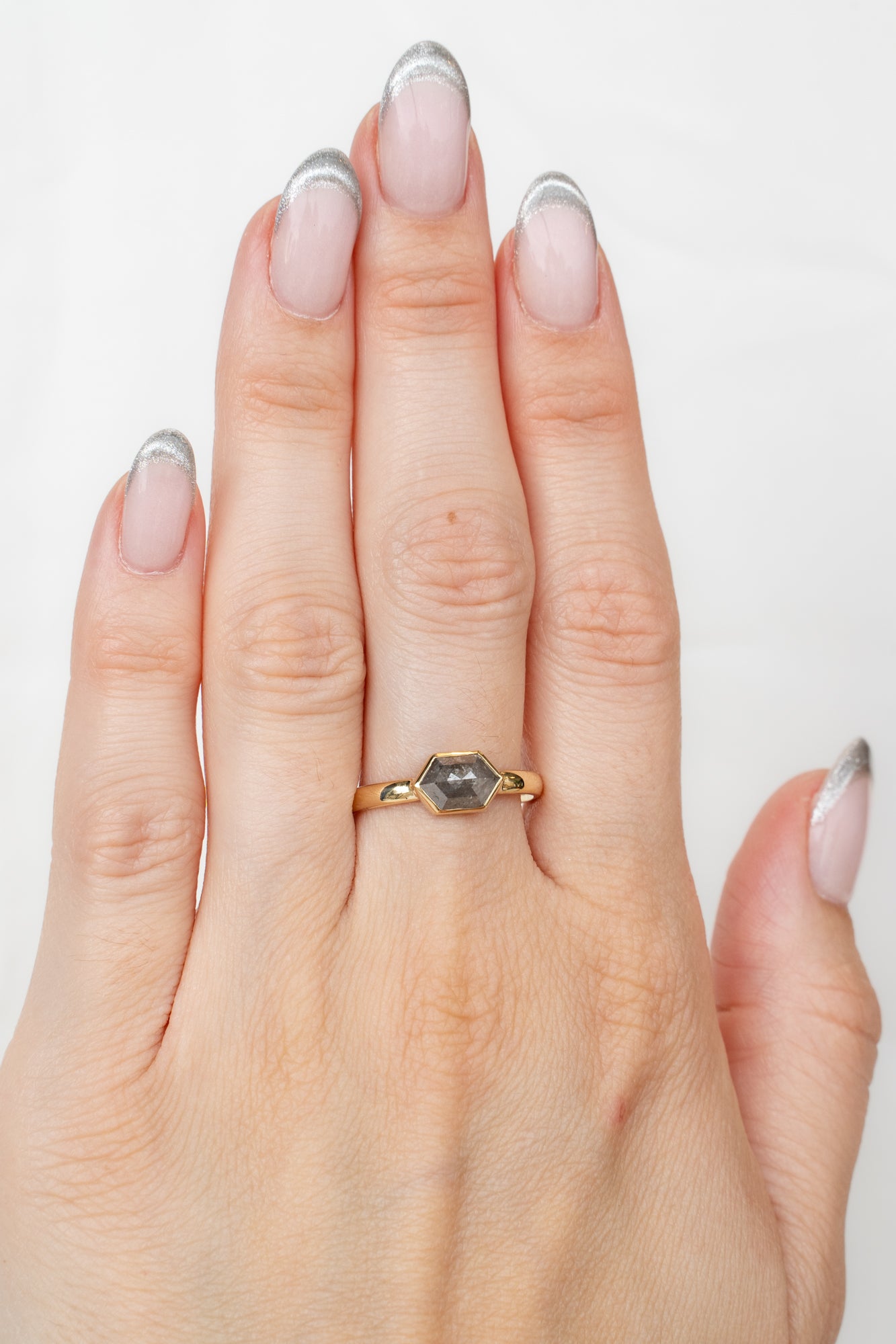 Model showcasing Bellatrix Ring with diamond