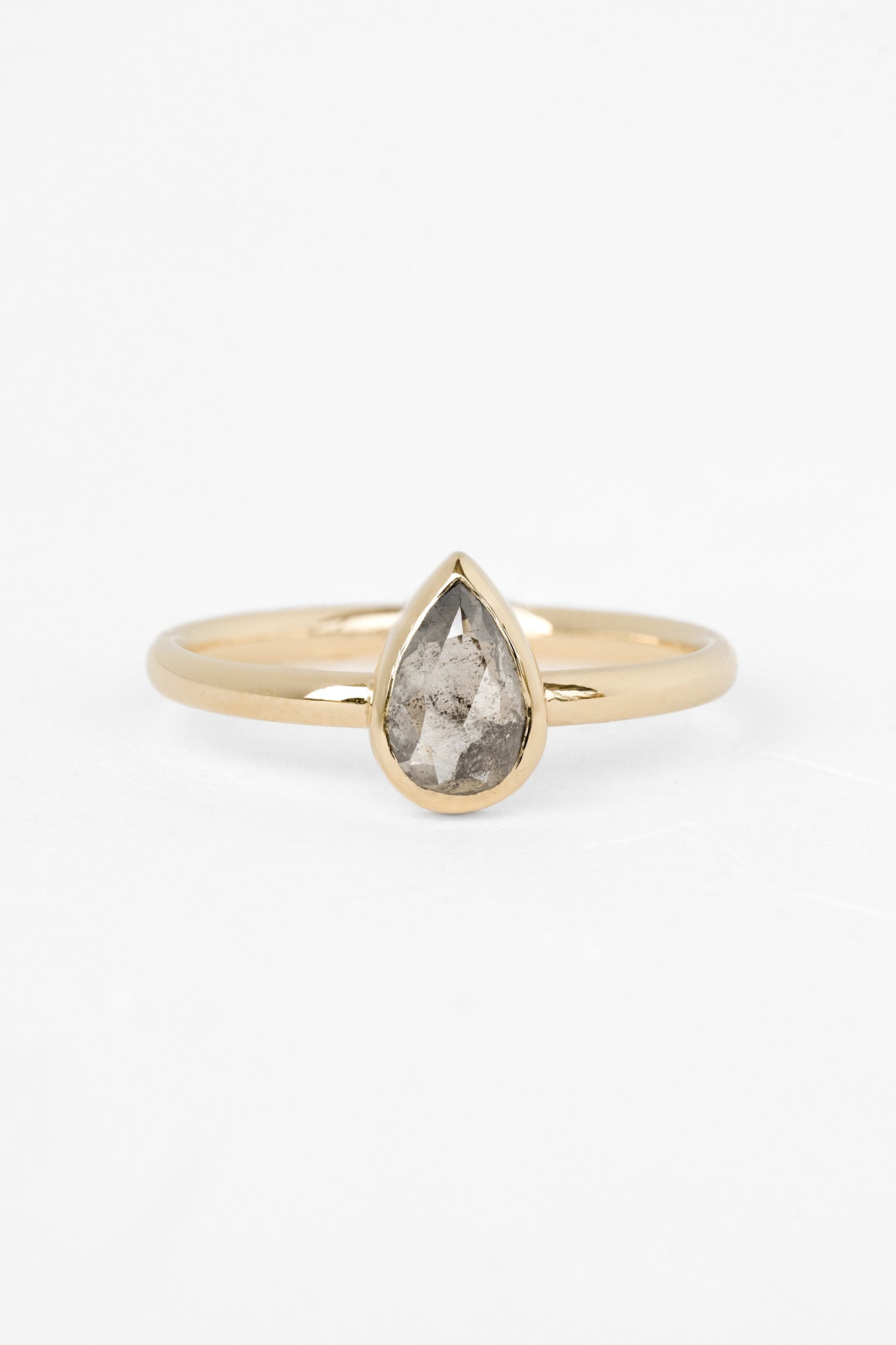 Elegant Bellatrix ring with salt-and-pepper diamond