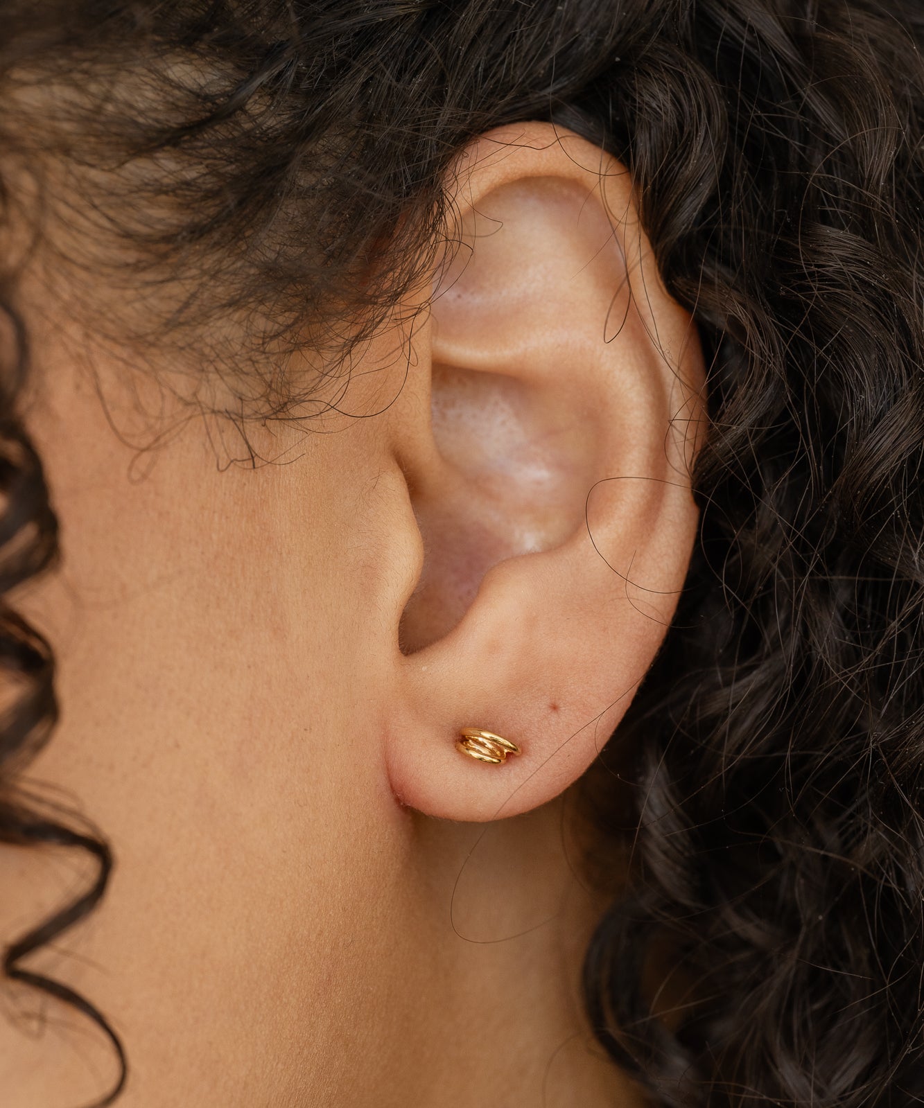 Elegant concentric vermeil stud earrings close-up