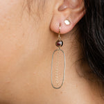Model wearing elegant gold hoop earrings
