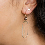 Model wearing elegant gold hoop earrings