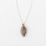 Minimalist solid silver vertical necklace close-up