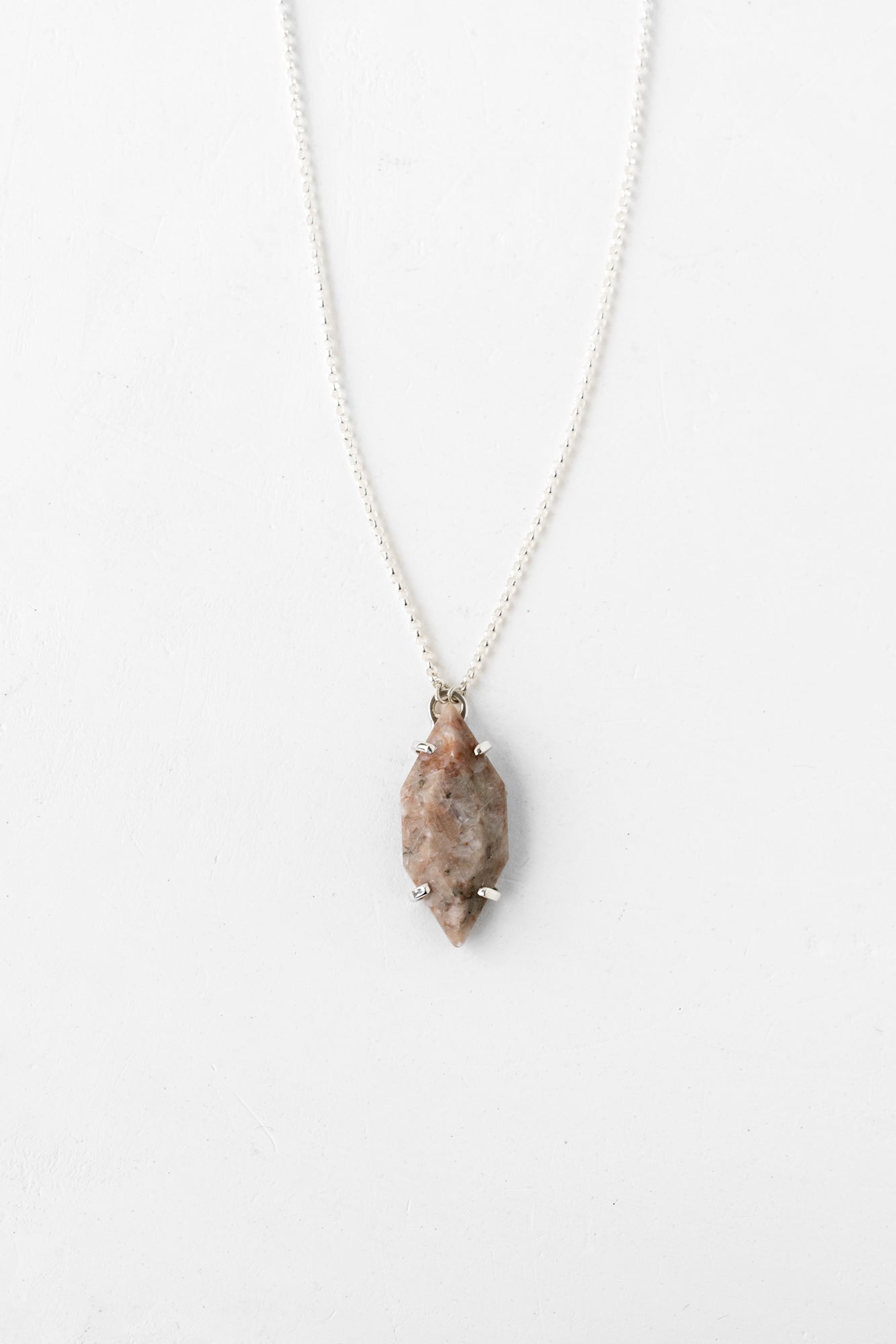 Minimalist solid silver vertical necklace close-up