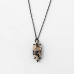 Vertical speckled oxidized necklace on neutral