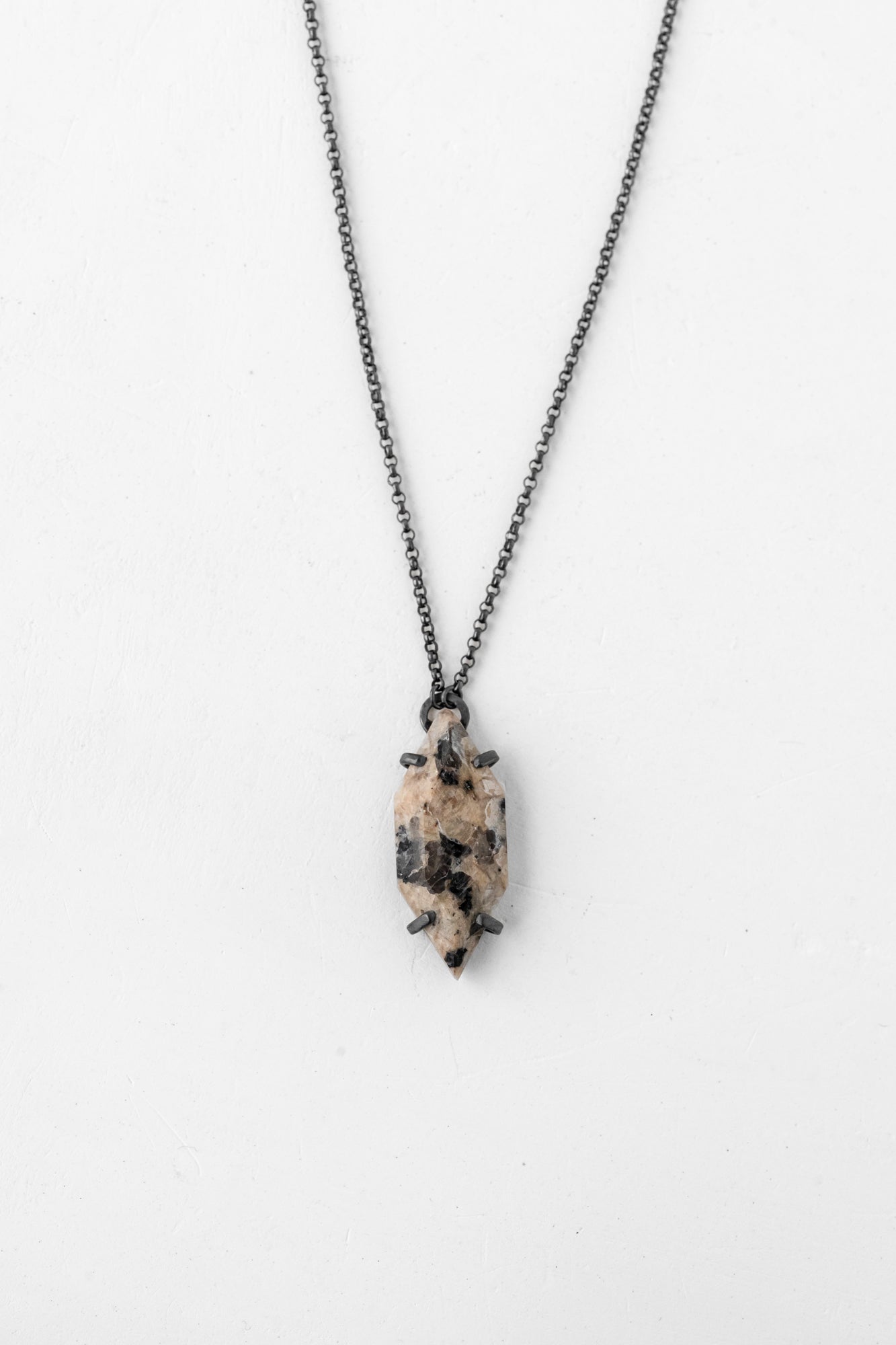 Vertical speckled oxidized necklace on neutral