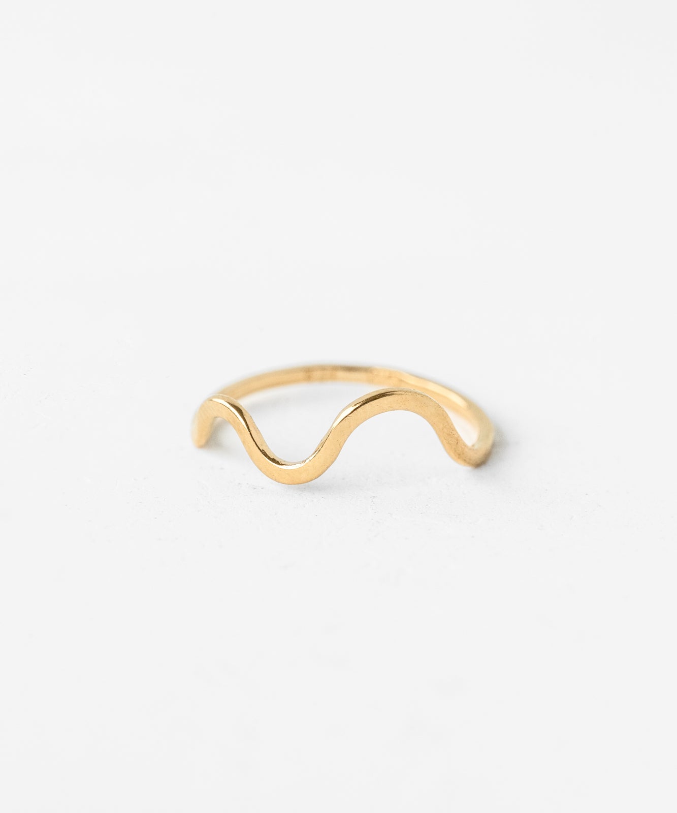 Gold vermeil wave ring on white background