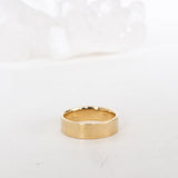 Close-up of minimalist gold necklace pendant