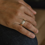 Model showcasing wide band rings elegantly