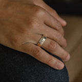 Model showcasing wide band rings elegantly