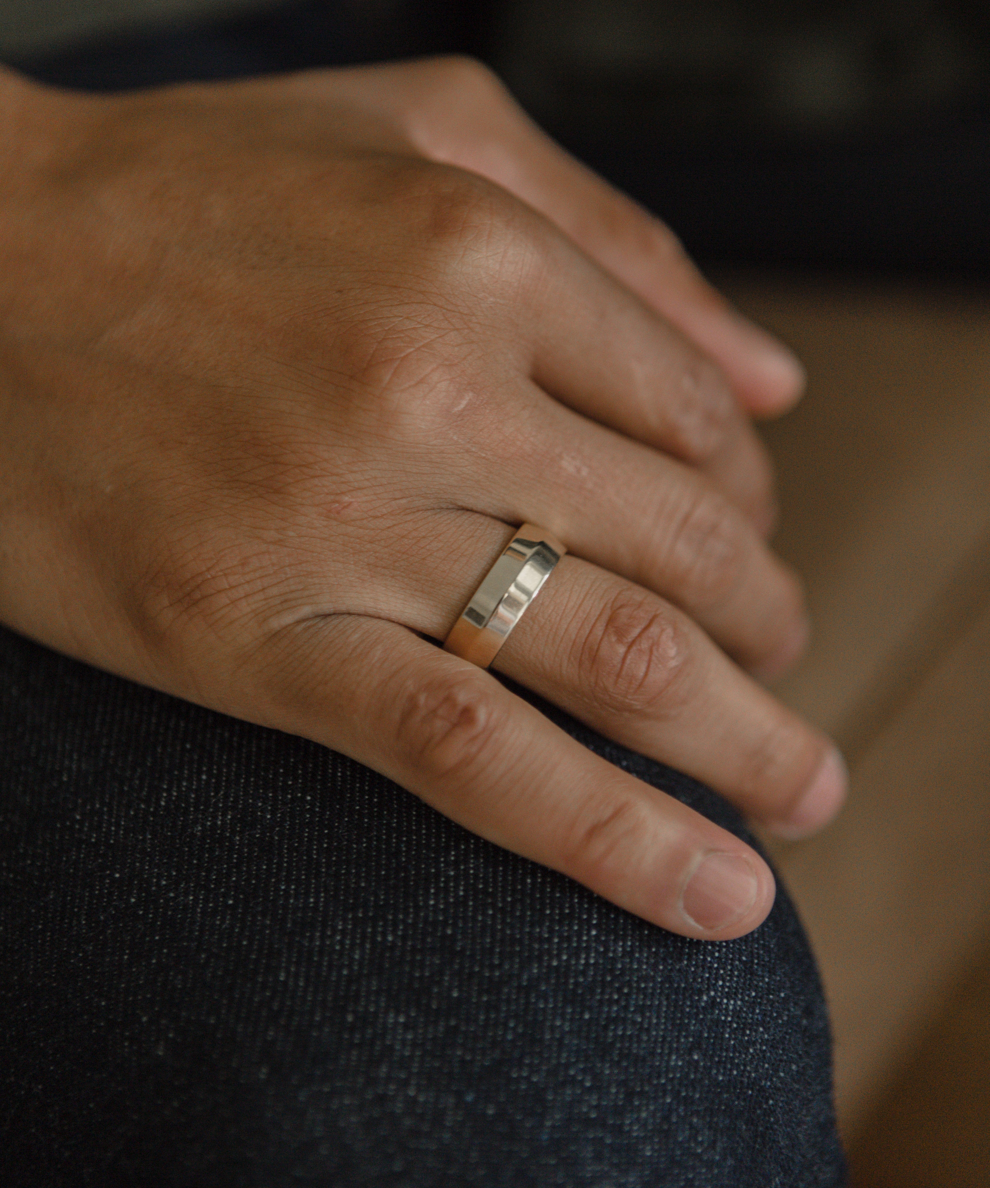 Model showcasing wide band rings elegantly
