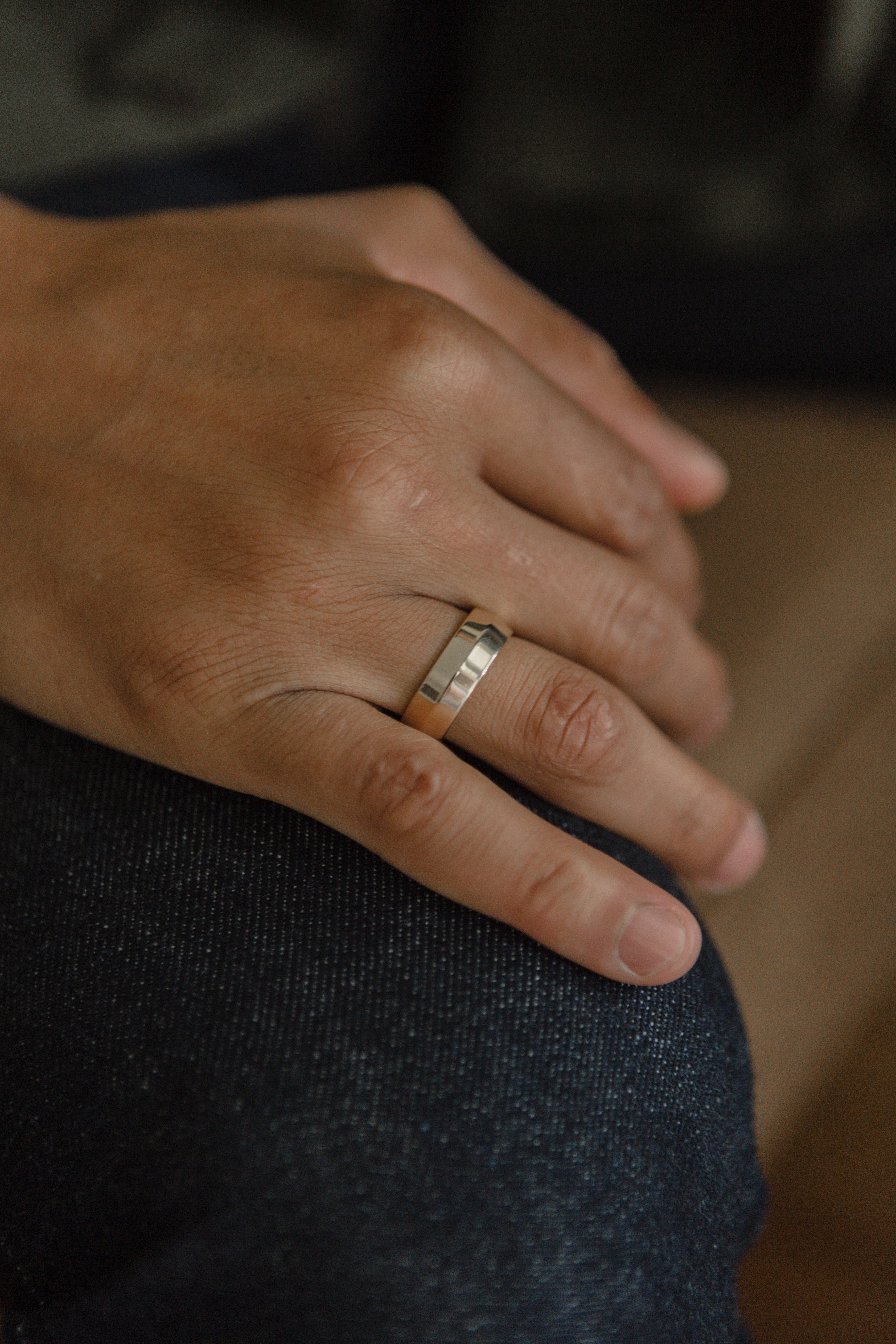 Model showcasing wide band rings elegantly