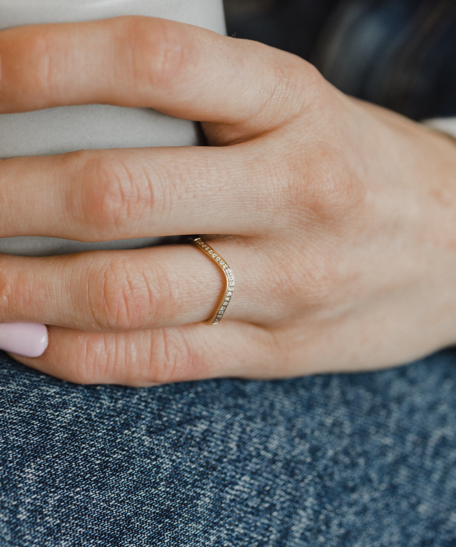 Model showcasing delicate gold diamond contour ring