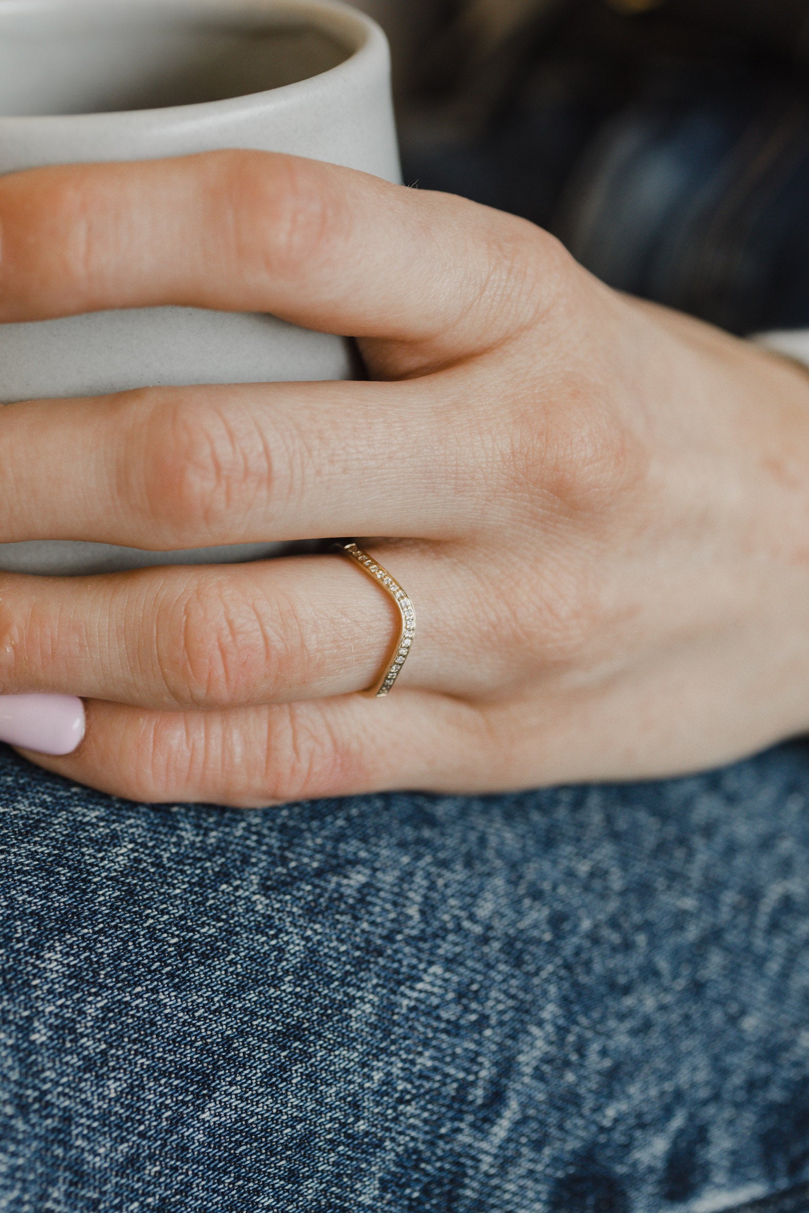 Model showcasing delicate gold diamond contour ring