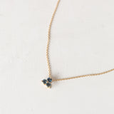 Gold Trinity and Moon necklace close-up